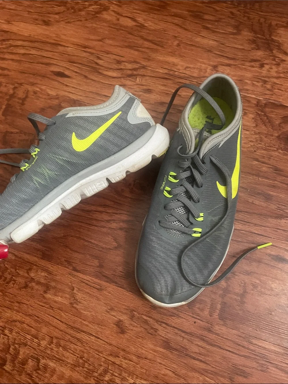 Nike women’s Gray & Neon Yellow Training Sneakers